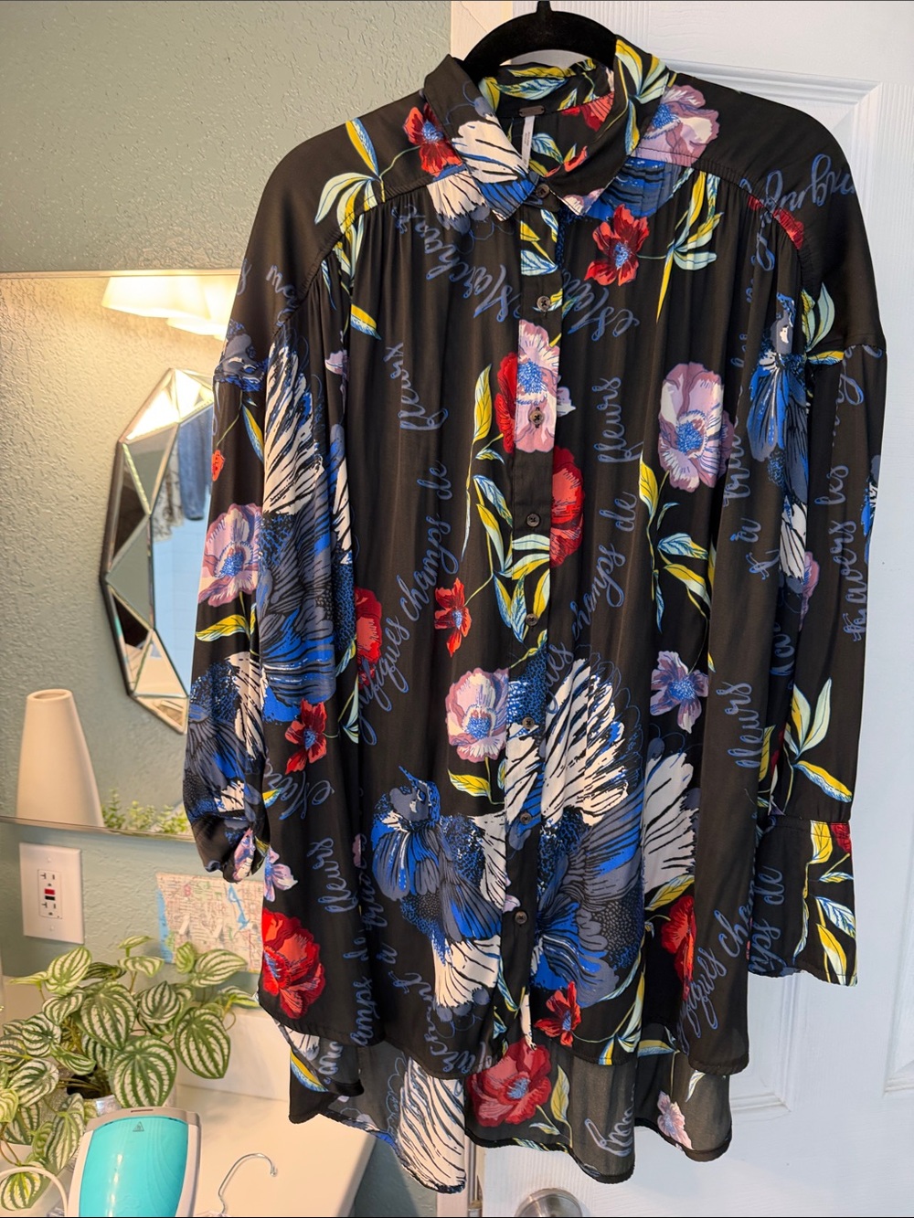 Free People Black Floral Button-Down Shirt with Blue, Red, Purple flowers.